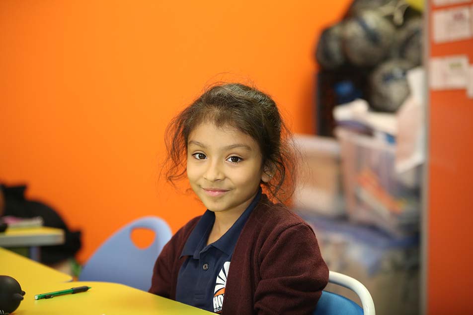 students and teacher working in classroom